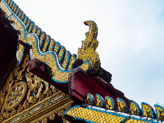 Fototapeta na wymiar Beautiful old roof is texture colors Gold,Designed by Thai people,Temple name is Wat kaew at Bangkok Thailand
