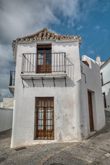 Traditional house in a street of Vejer de la Frontera, a beautiful white town in the province of Cadiz, Andalusia, Spain