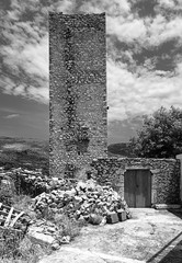 Old stone tower house in black and white. Mani, Peloponnese, Greece.