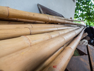 Long bamboo is pile up mountain high,Used as a building material,Is a natural material
