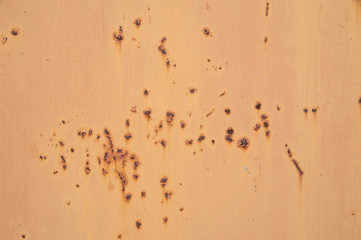 Abstract background. Rust on yellow painted metal surface. Background, structure.