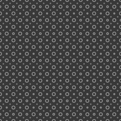 Fototapeta na wymiar White circles and dots on a black background. Abstract seamless circles background.