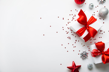 Christmas and New Year holiday background. Xmas greeting card. Christmas red ribbon gifts and...