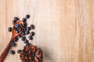Coffee beans on a wooden spoon