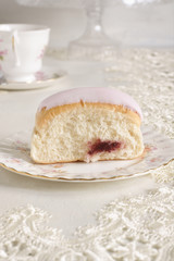 Iced bun filled with jam 