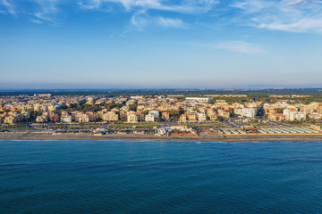 Obraz premium Aerial view of Ostia beach near Rome, Italy. Beautiful sea, coast and city view from above, drone photo.