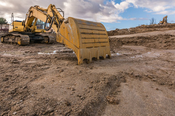 Excavator on a hard day of work on a construction site