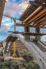 Fototapeta premium Construction of the structure of a bridge for a motorway in Spain on the ring road of Segovia