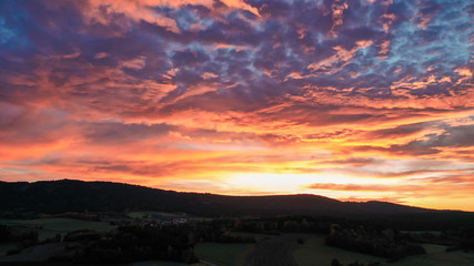 a dreamy morning sky in red and pink tones , morning red in the sky 