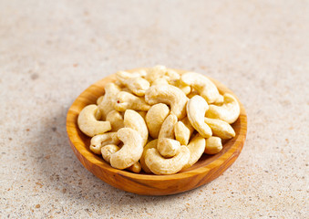cashew nuts in a wooden bowl