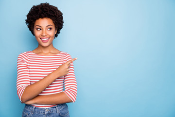 Photo of cheerful positive sweet pretty girlfriend standing confidently pointing into empty space...