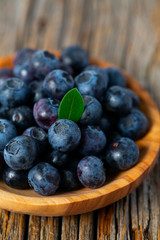 fresh blueberries in a wooden bowl