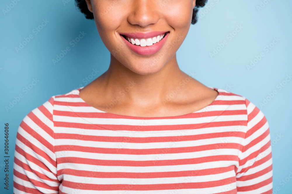 Poster Close up cropped photo of youngster smiling with her white teeth after work of dentist isolated blue pastel color background