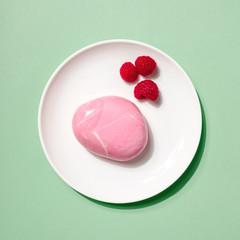 Creative layout made of Cheesecake with Raspberry berry in hard light on colorful pink background. Hard shadow, minimal flat lay style. Food concept. Fruit pattern top view.