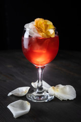 cocktail with ice and rose petals