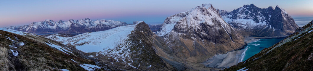Panorama overlooking the mountains of Lofoten from Ryten. Pano, hiking, blue hour, photographer, pink sky, wander, nature, landscape concept.