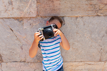 cute boy is photographing 