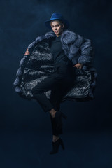 jumping fashionable woman