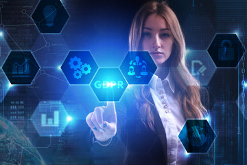 Business, Technology, Internet and network concept. Young businessman working on a virtual screen of the future and sees the inscription: GDPR