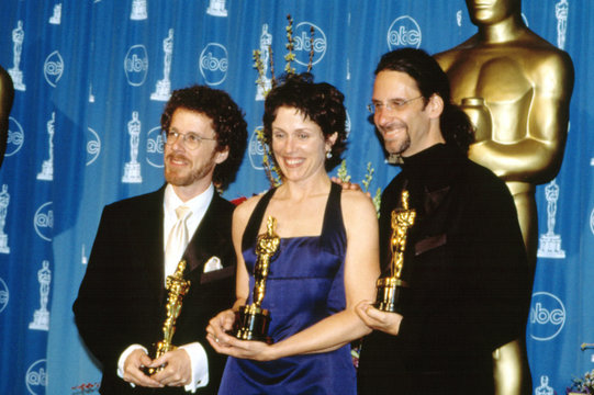 THE COEN BROTHERS: Ethan (L) and JOEL (far right) happily accept their FARGO Oscars along with their star