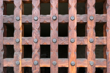 wooden grill protects the entrance to the basement cellar