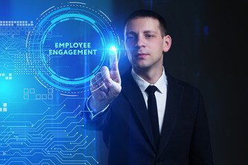 Business, Technology, Internet and network concept. Young businessman working on a virtual screen of the future and sees the inscription: Employee engagement