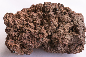 The piece of volcanic lava on a white background