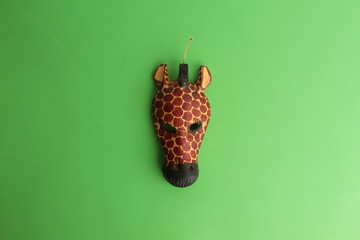 giraffe carved on piece of wood