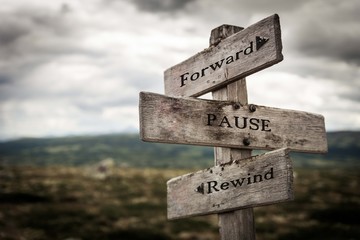 Forward, pause, rewind signpost in nature. Move forward, future, signs, wild, life concept.