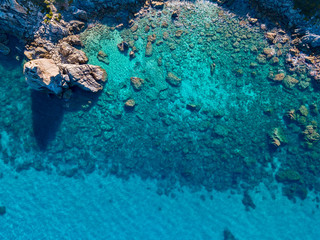Aerial view of Tropea beach, crystal clear water and rocks that appear on the beach. Rock Pizzuta. Calabria, Italy