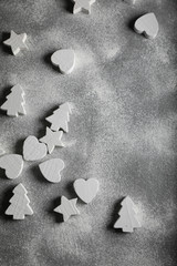 Grey concrete background with Christmas decorations. Space for text. Holidays.