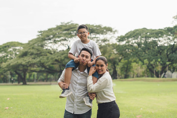happy family running in the park, family asian group relation quality healthy support, home park .