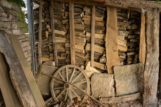 A store of firewood in an old barn in rural France.