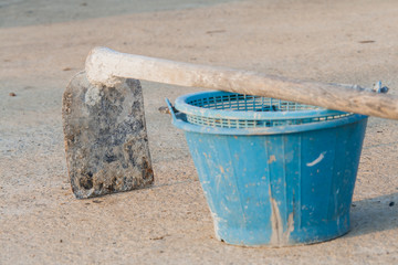 construction blue bucket and  hoe