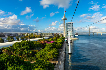  Lisbon skyline on the shore of Tagus river across Olivais Dock, Parque das Nacoes (Park of...