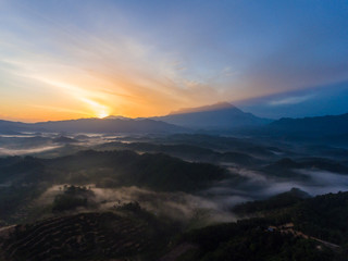 Aerial image of Amazing Beautiful Nature landscape view of Sunrise with  nature misty foggy and Mount Kinabalu, Sabah, Borneo