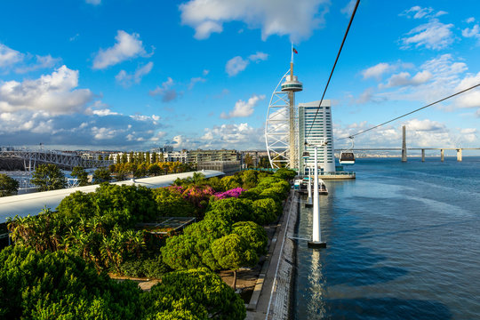  Lisbon skyline on the shore of Tagus river across Olivais Dock, Parque das Nacoes (Park of Nations), Portugal. View from gondola lift.