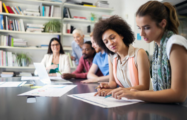 Creative business people working on business project in office