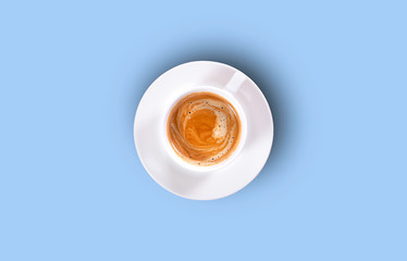 Cup of black coffee on a blue background. Top view. Hard shadow.