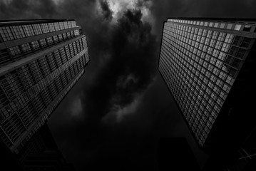 buildings under black clouds