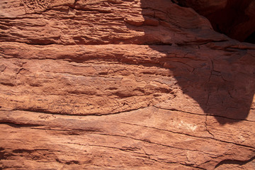 Time and water leave their marks on the surface of the sandstone rock faces of Capitol Reef National Park, Utah