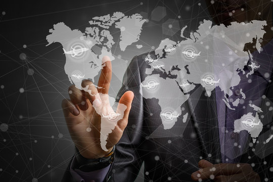 Businessman touching on world map plane