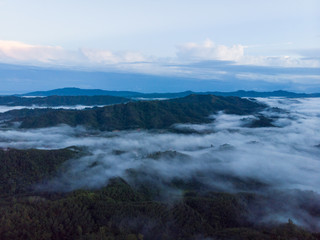 Naklejka na ściany i meble Aerial image of Amazing Beautiful Nature landscape view of Sunrise with nature misty foggy and Mount Kinabalu, Sabah, Borneo