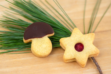 Christmas linzer sweets and cookies made from shortcrust pastry, various shapes filled with marmalade, decorated with chocolate