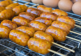 Grilled northeastern spicy sausage of Thailand. Local food made from pork and rice. Native and street food.