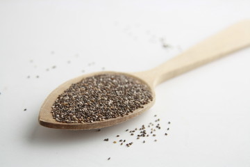 wooden spoon with black chia seeds