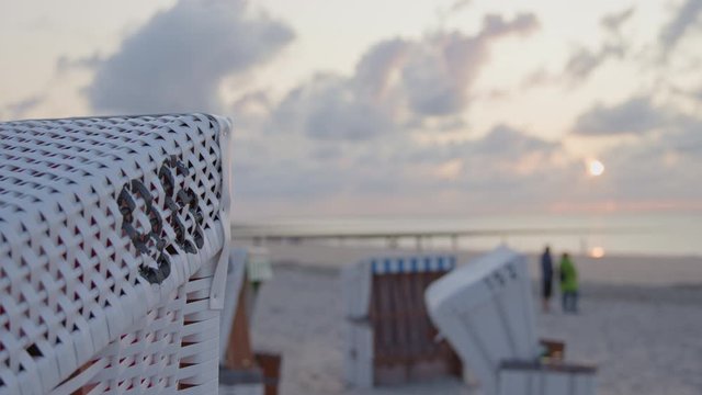 Beach Chair during beautiful sunset at Baltrum Island, Germany.