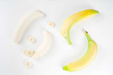 Pattern of fresh banana slices isolated on white background top view