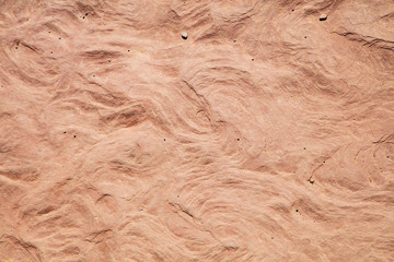 Time and water leave their marks on the surface of the sandstone rock faces of Capitol Reef National Park, Utah