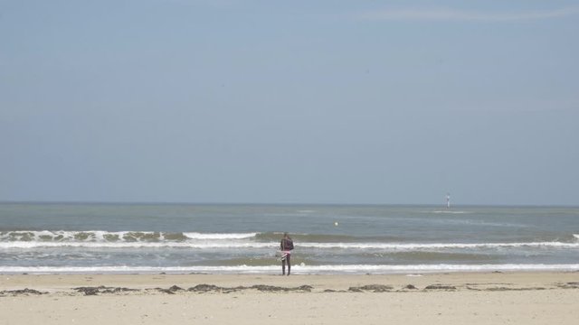 Margate beach with people walking by the sea